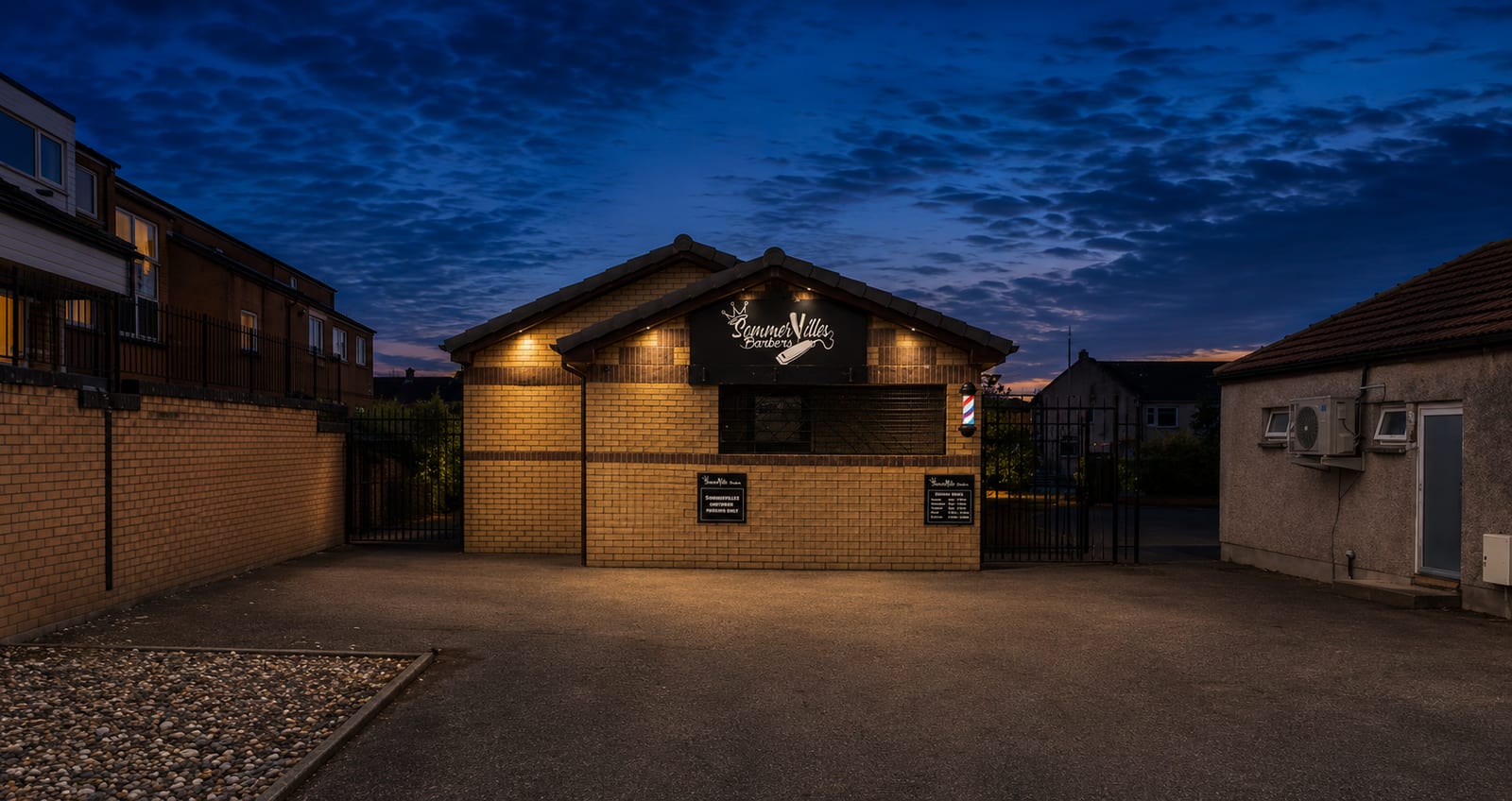 Sommervilles Barbers shopfront on Finlarig Terrace, Dundee, lit up at dusk
